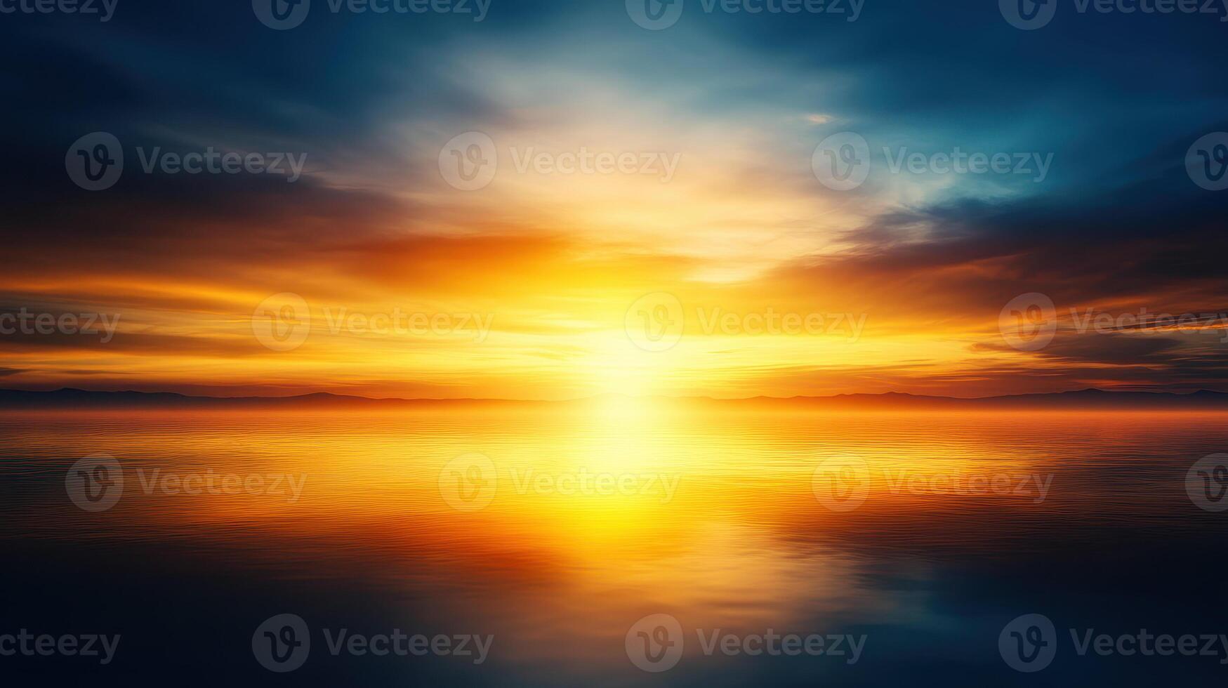 Stunning golden sunrise over calm water, reflecting vibrant colors photo