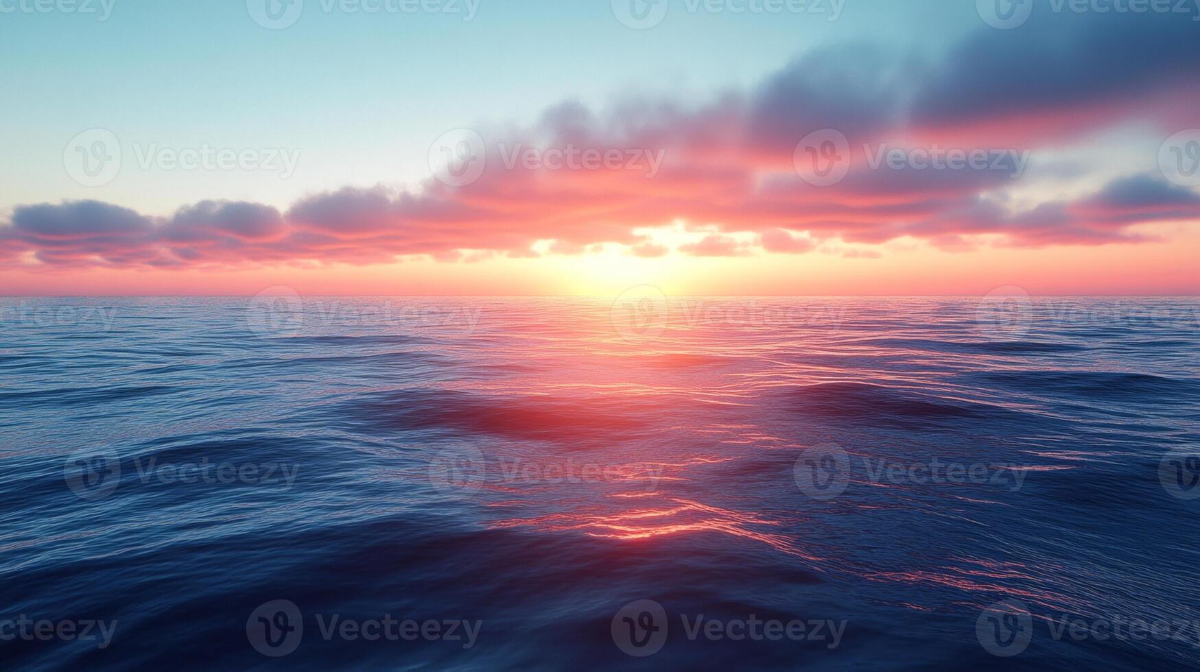 A sunset over the ocean with clouds in the sky photo