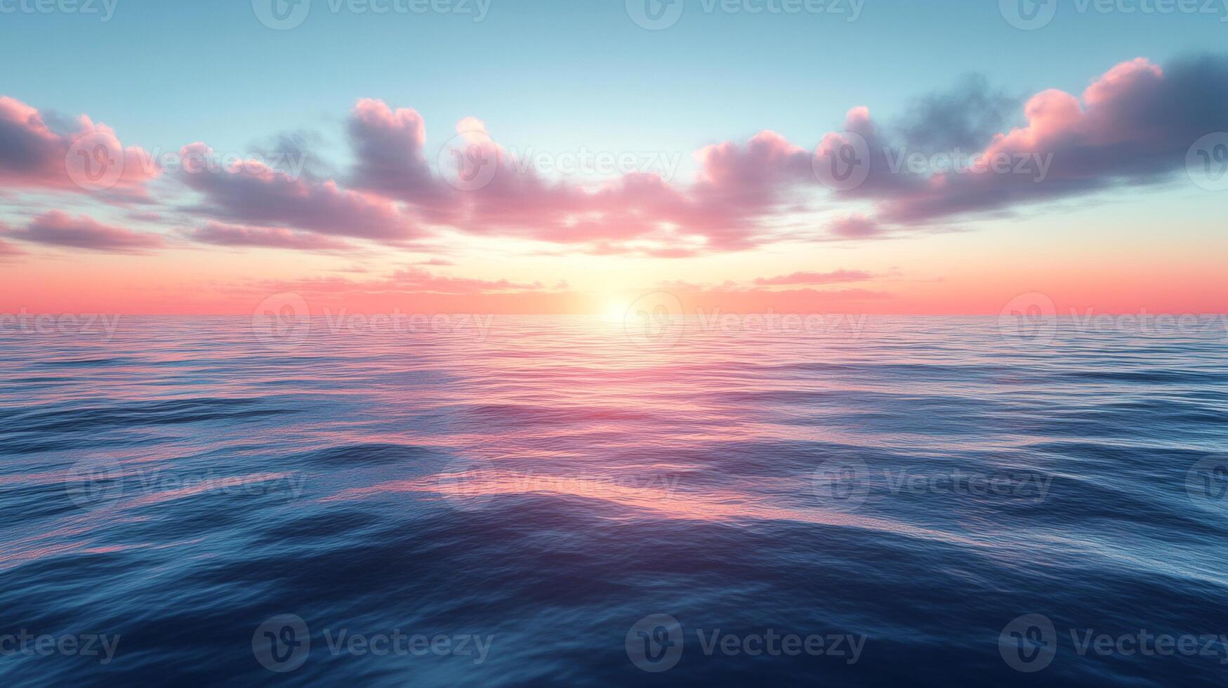 A beautiful sunset over the ocean with clouds photo