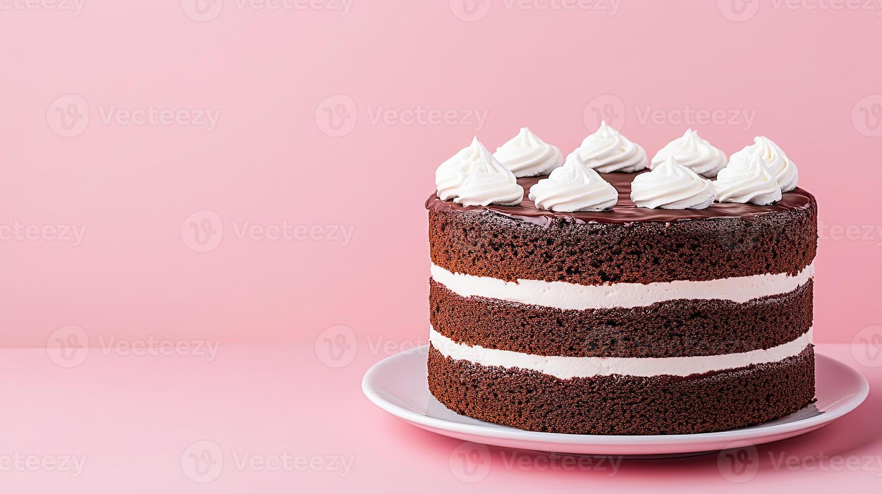 Delightful Chocolate Cake with Whipped Cream on Pink Background photo