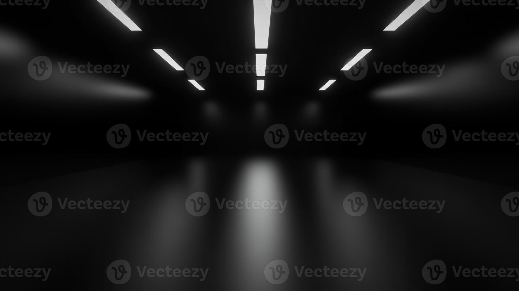 A dark hallway with recessed ceiling lights casts a reflective glow on the smooth floor below photo