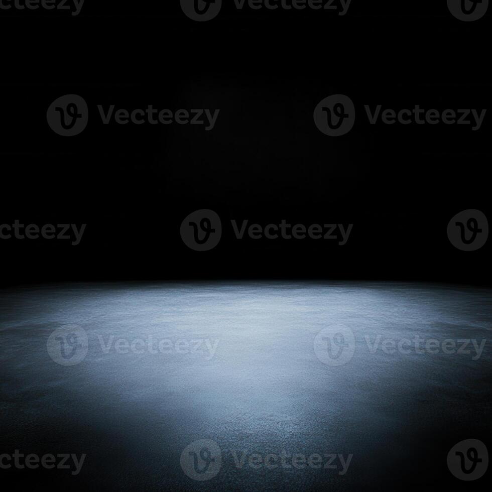 A dimly lit room with a smooth, illuminated floor that recedes into the darkness in the background photo