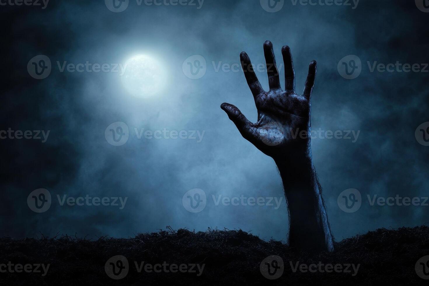 A decaying hand emerges from the earth beneath a full moon, creating an eerie and haunting scene photo