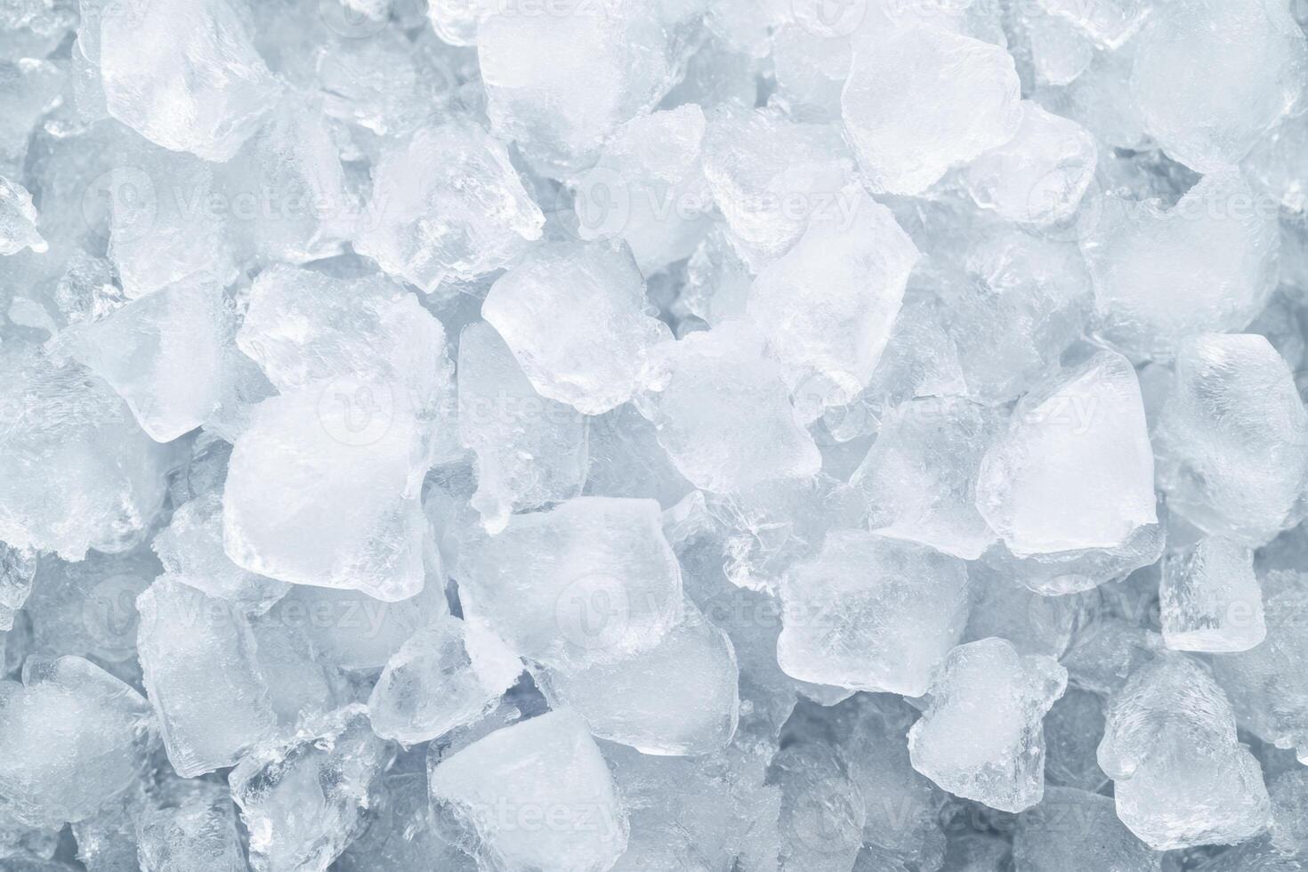 Crushed clear ice cube background texture provides a visually appealing cool refreshment. photo