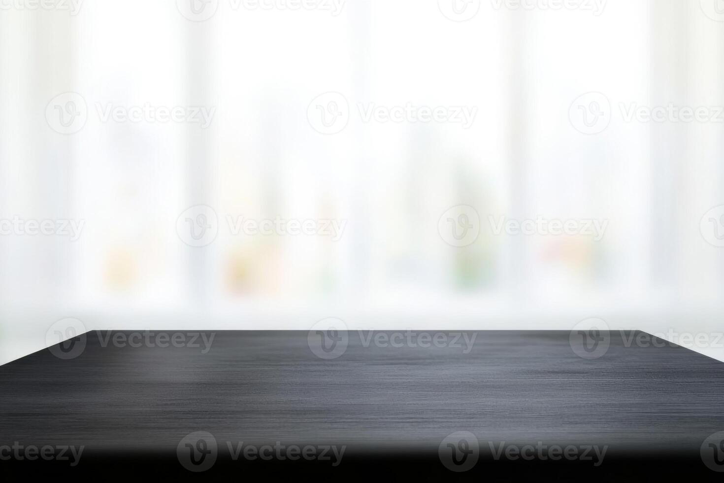 Dark wooden tabletop, close-up shot against a softly blurred background, creating spacious atmosphere photo