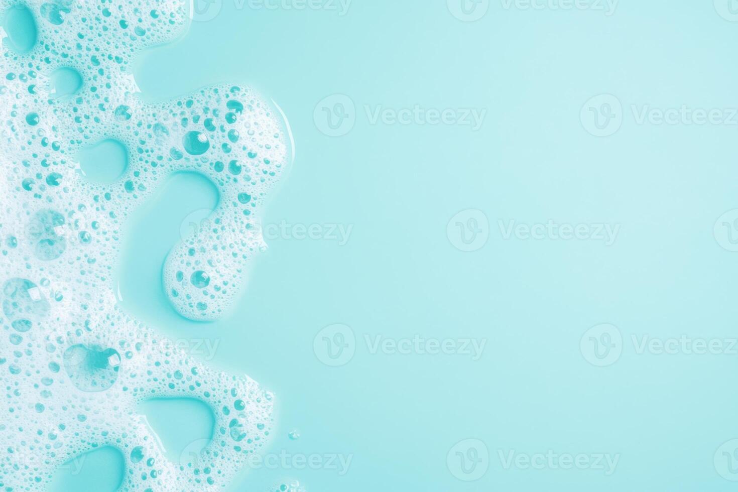 Foam and bubbles in a turquoise bath water setting. Soothing and relaxing background. Space for text photo