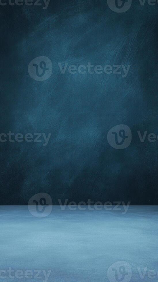 Studio shot of a textured blue wall and floor providing a simple, muted, and elegant backdrop photo