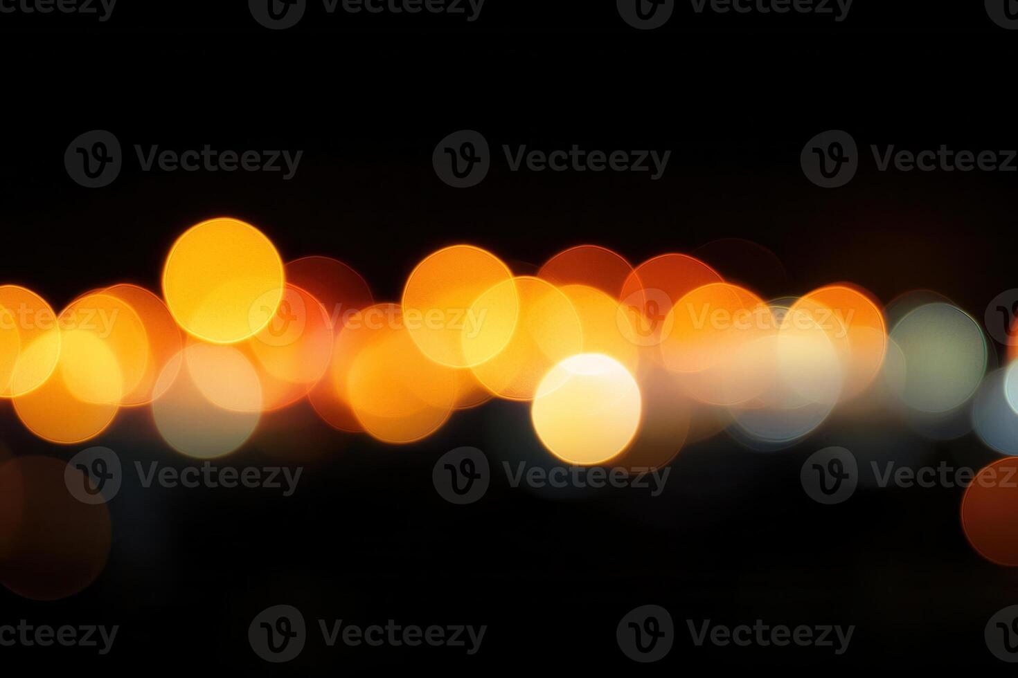 Abstract bokeh light, a blurred arrangement of bright, round shapes on a dark, black background photo
