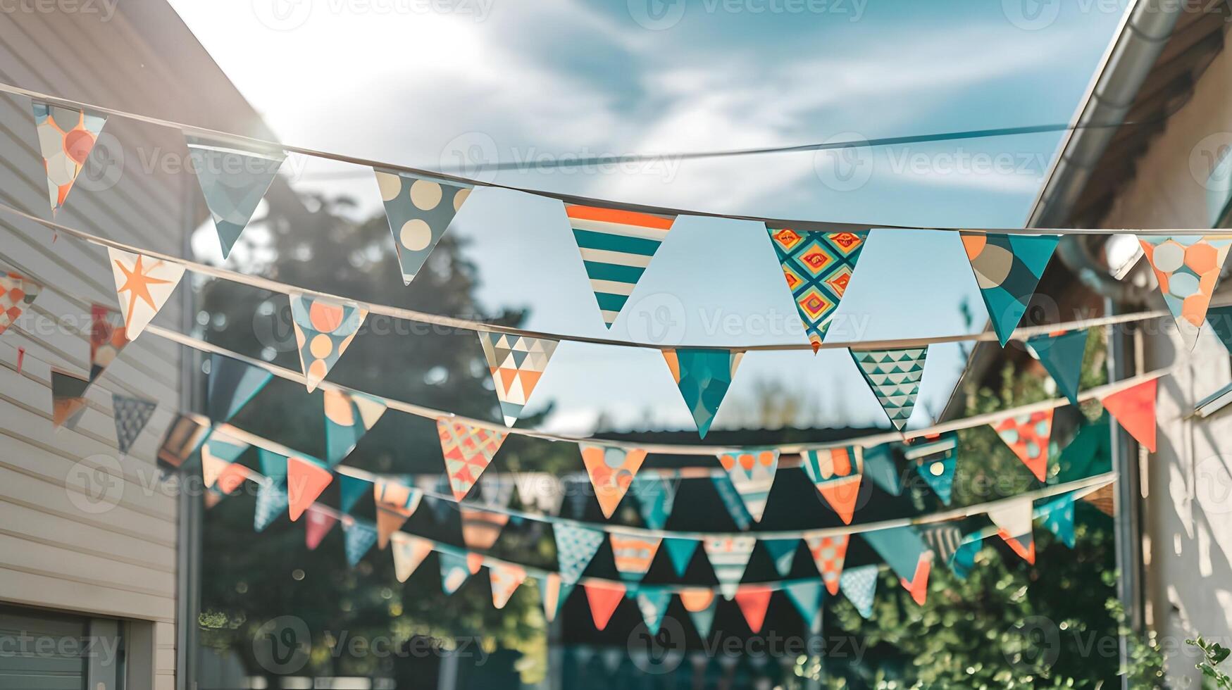 Colorful triangular bunting creates a cheerful and festive atmosphere strung between buildings. photo