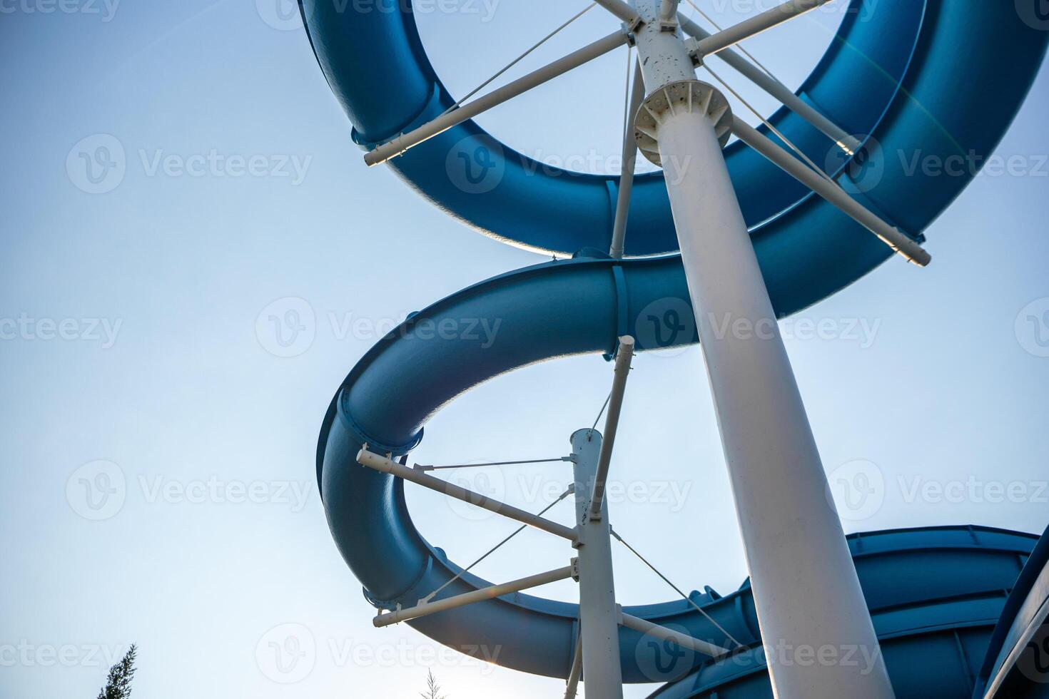 Water Slide Cruise Ship Fun. A low angle view of a blue water slide on a cruise ship. photo