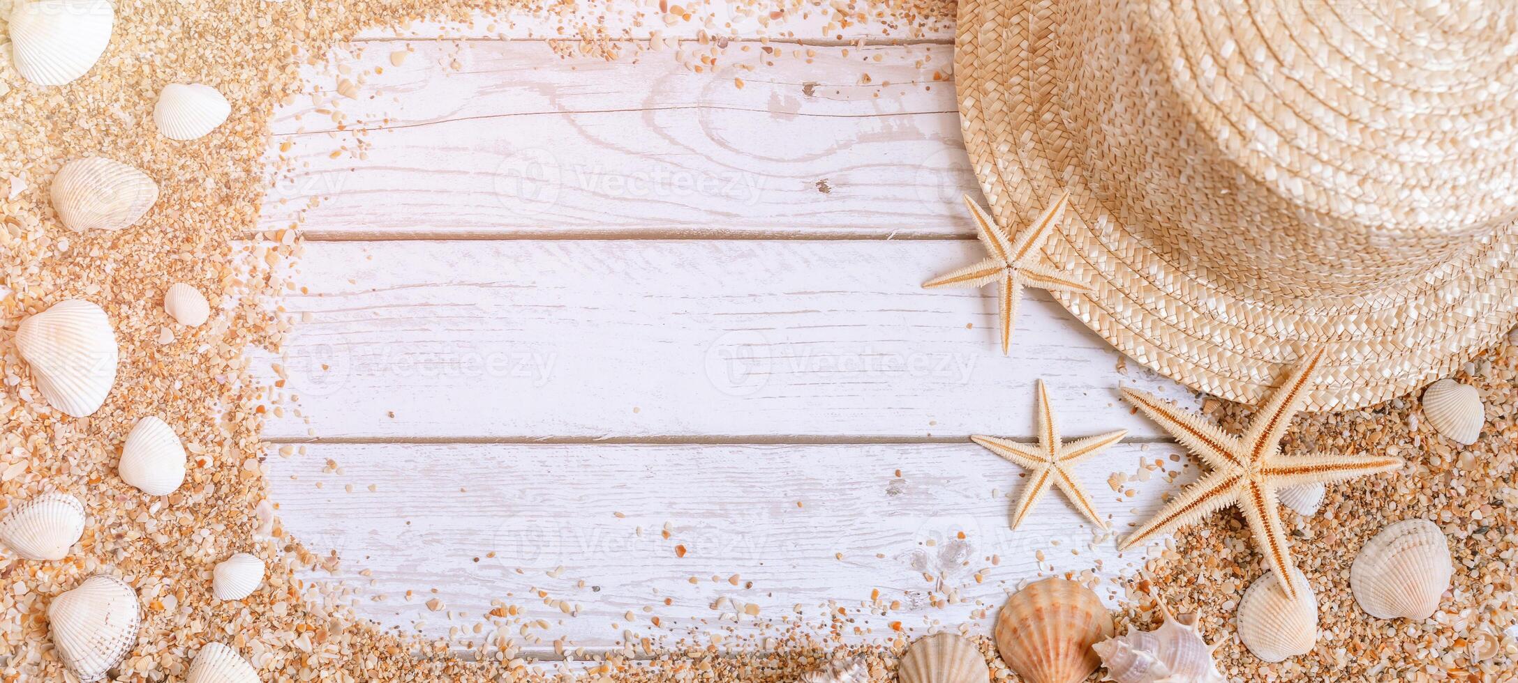 Sand seashells baner background. Summer time concept with sea shells and starfish on wooden background and sand photo