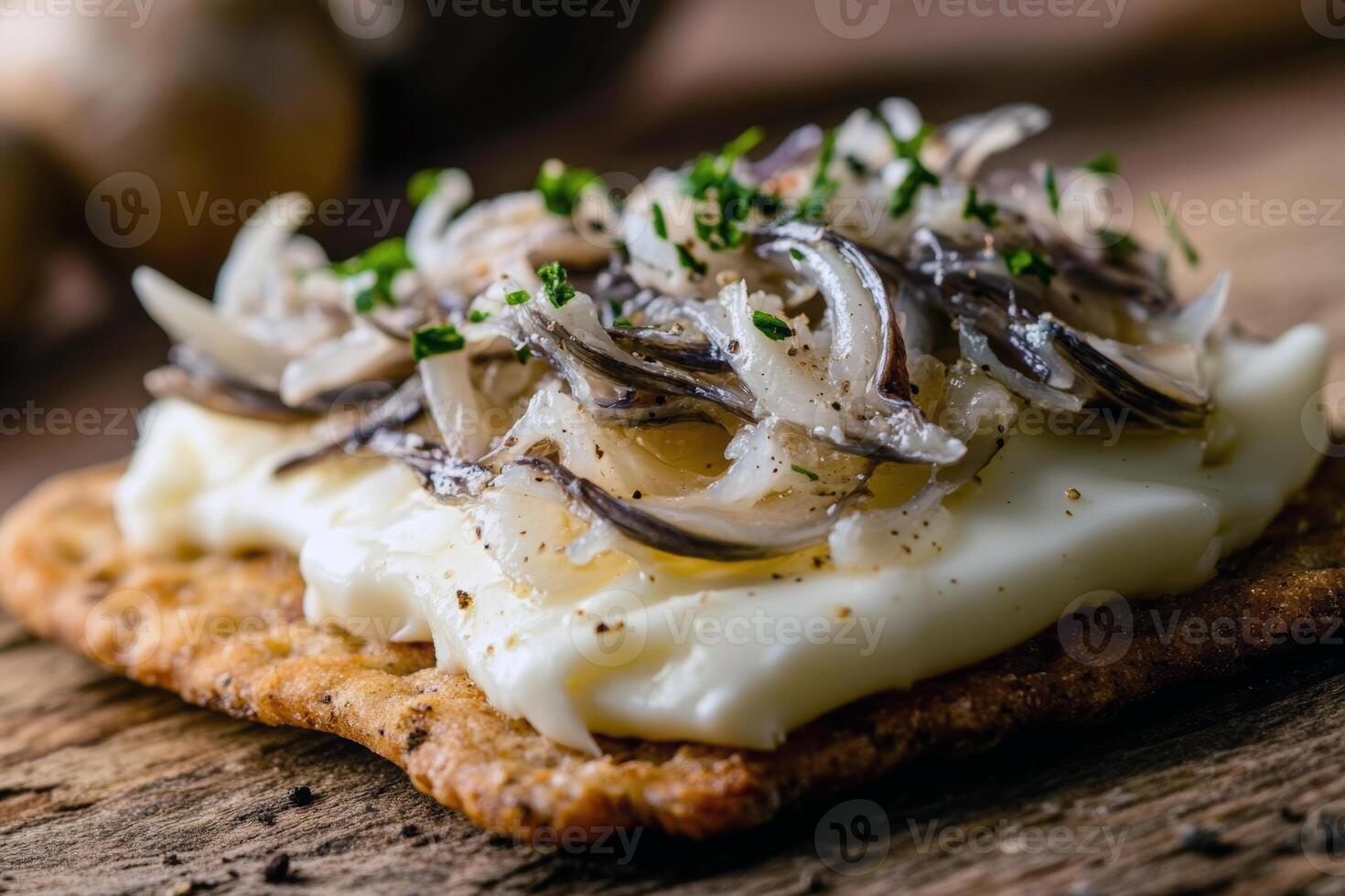 Delicious smoked fish on crispbread with cream cheese and fresh herbs photo