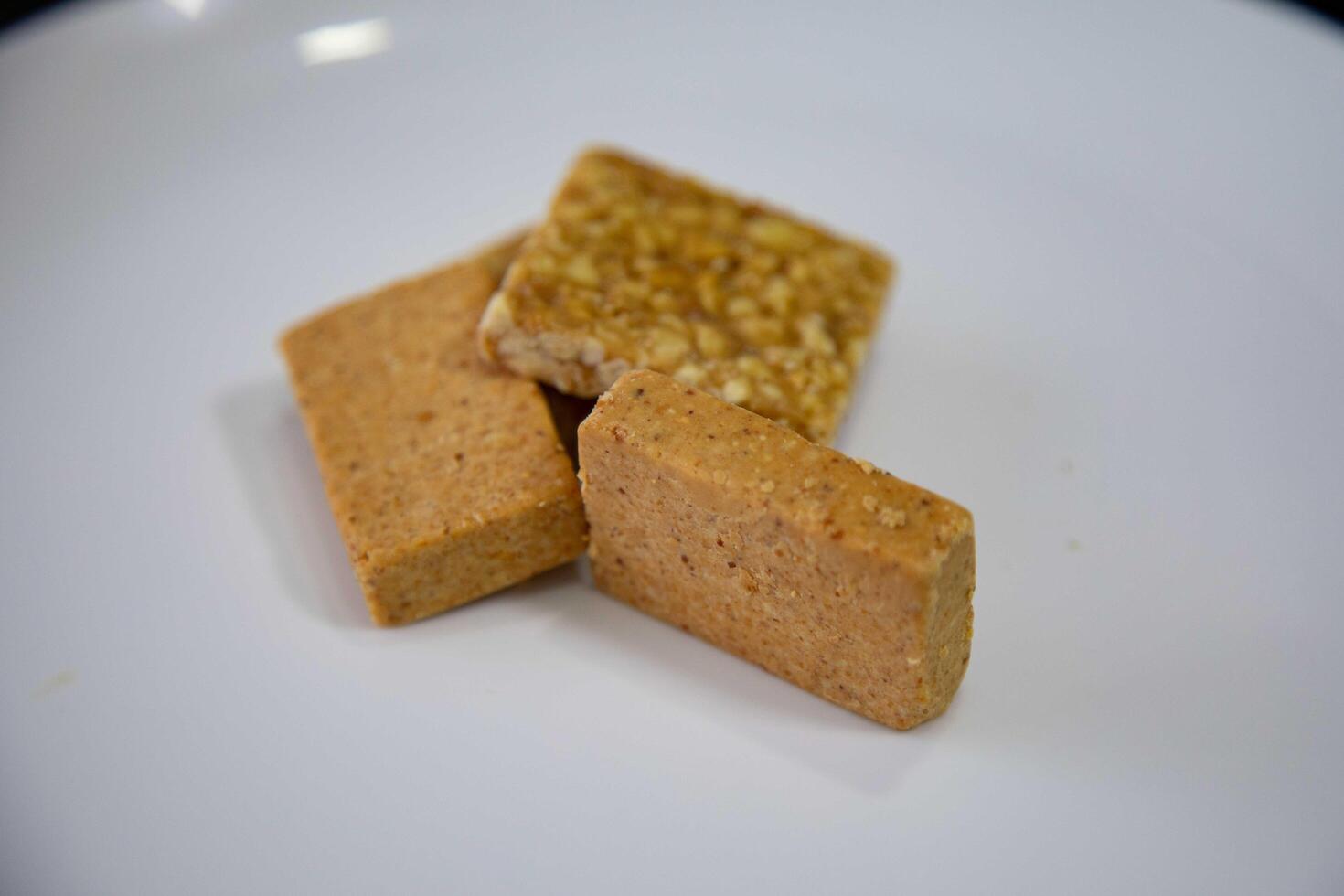 Pacoquinha is a sweet, crumbly Brazilian peanut candy made from ground peanuts and sugar, often enjoyed as a nostalgic snack photo