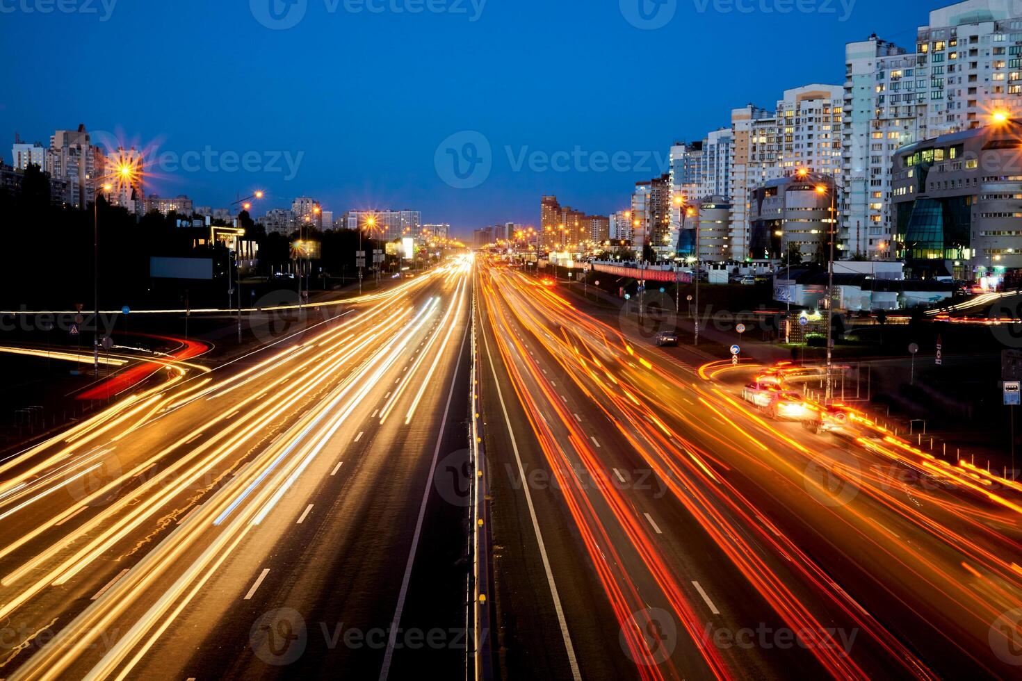 Night shining speed avenue with moving cars and lights photo