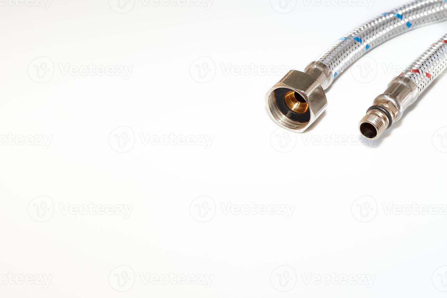 Plumbing tube. Flexible metal stainless steel faucet hoses photo