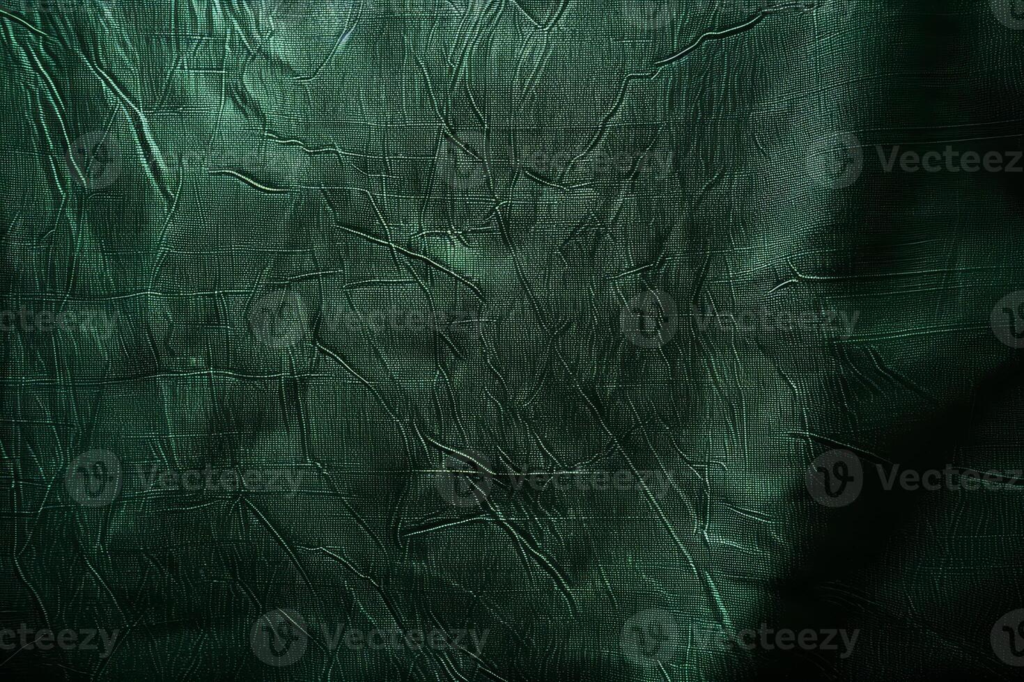 A rich dark green surface displays intricate textures, inviting artistic exploration and creative inspiration photo