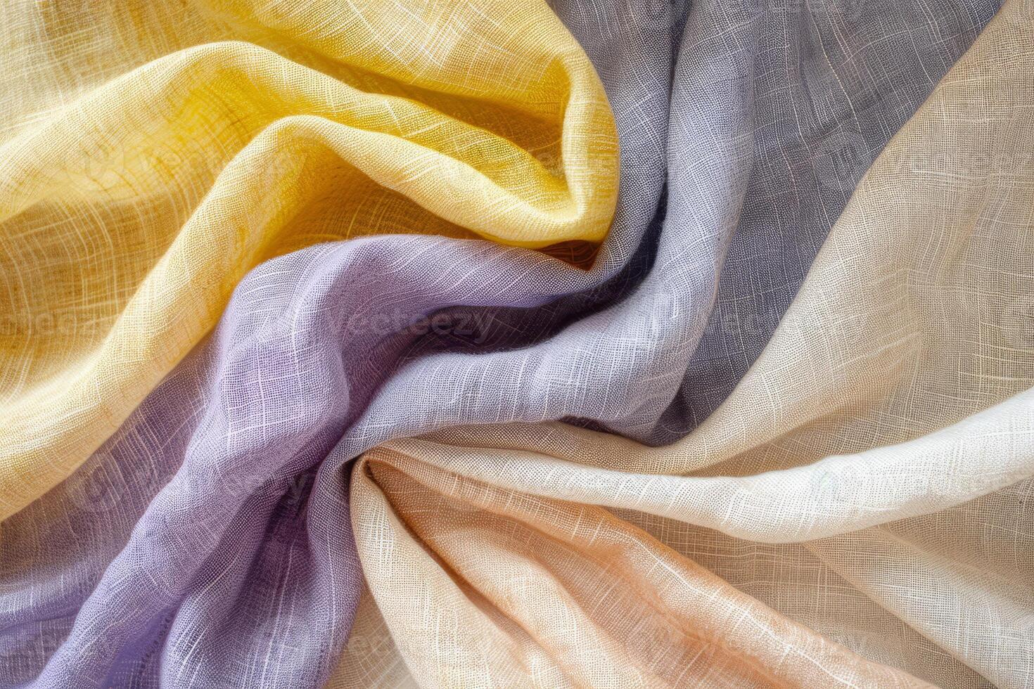 Linen fabric elegantly folds to reveal a soft palette of yellow, lavender, gray, and cream, showcasing its texture and lightness photo