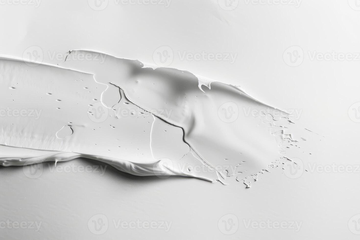 Soft, flowing white paint glides over a smooth watercolor paper surface, inviting creativity and contemplation in a serene moment photo