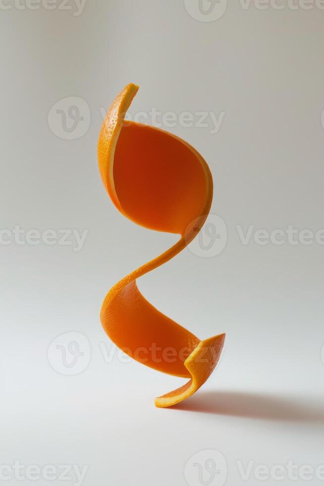 A single orange is sliced in half, revealing its bright, juicy flesh. The two halves are arranged in a spiral formation, creating a visually interesting display photo