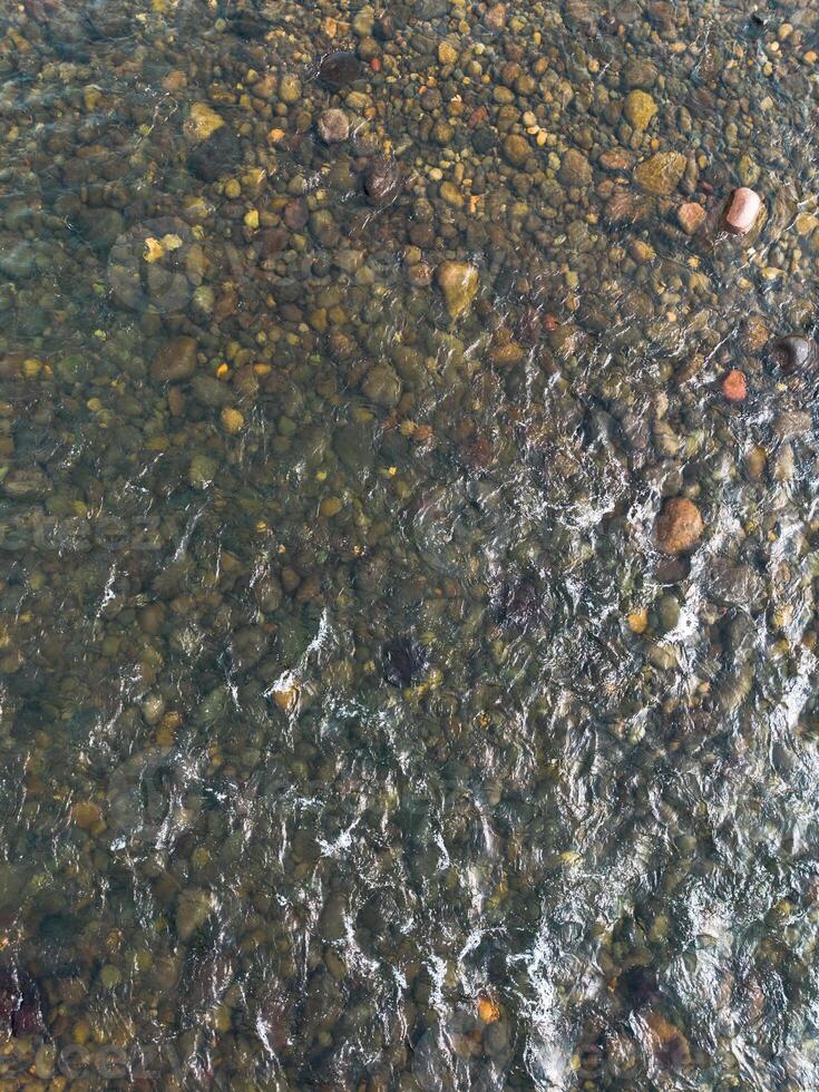 A river with rocks and water in it photo