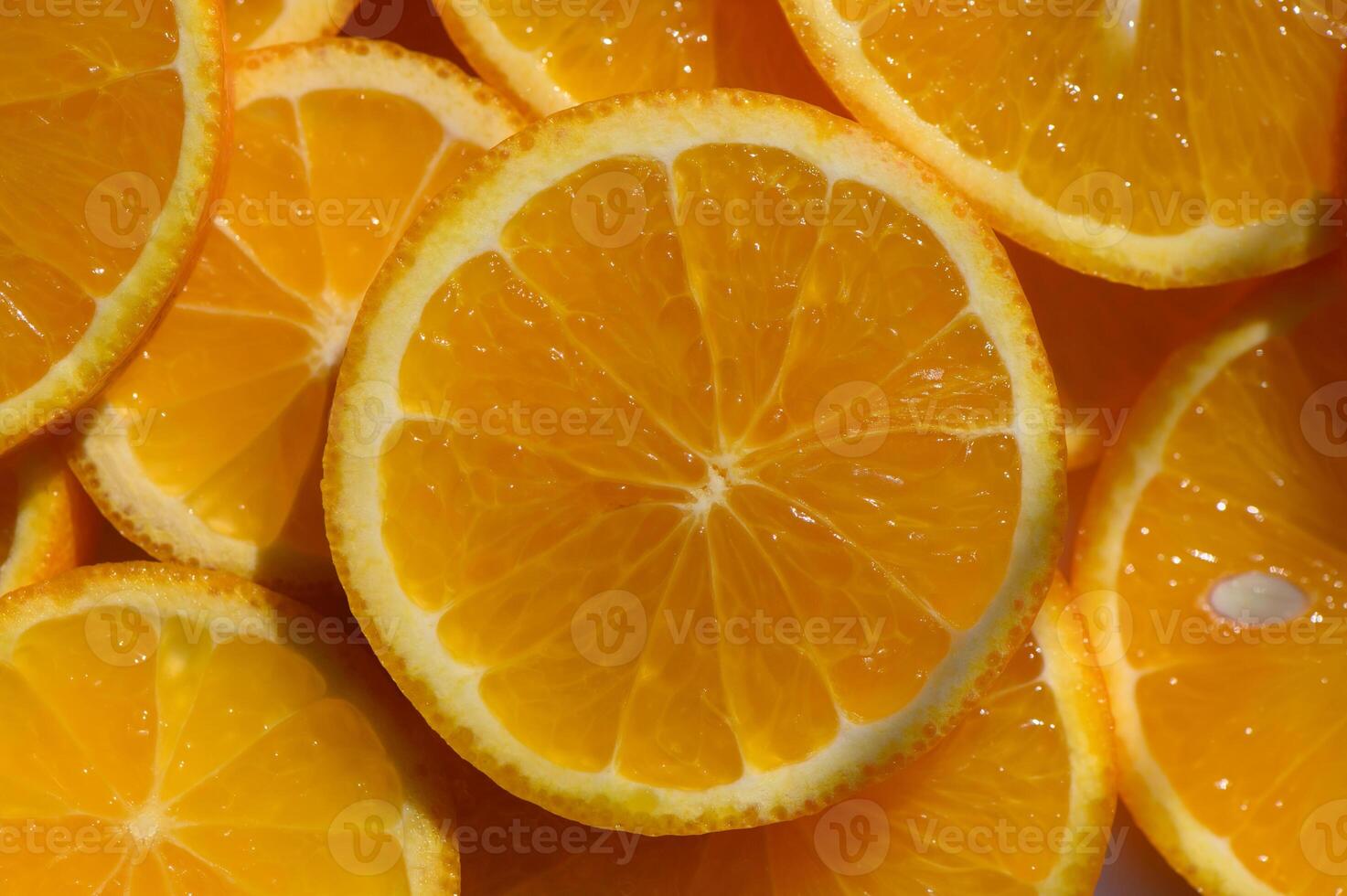 Bright orange citrus slices arranged artfully on a white surface in a vibrant kitchen setting photo
