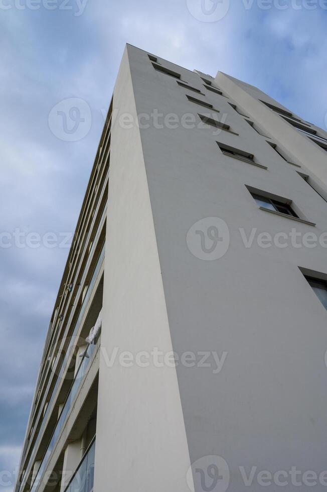 Modern architectural design captures the essence of urban living against a sky photo