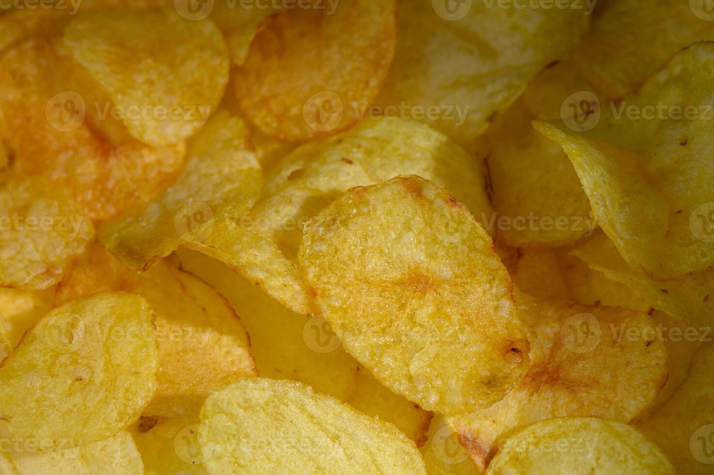 Crispy golden potato slices arranged for a tasty snack experience in a casual photo