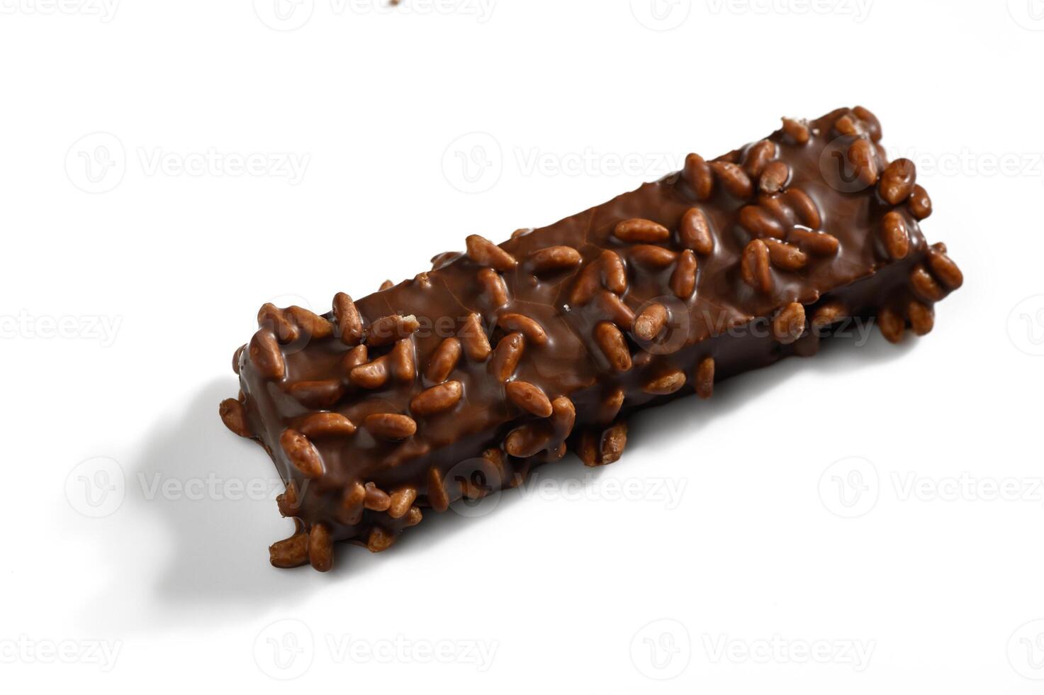 Delightful chocolate bar coated with crunchy rice pieces on a white background photo