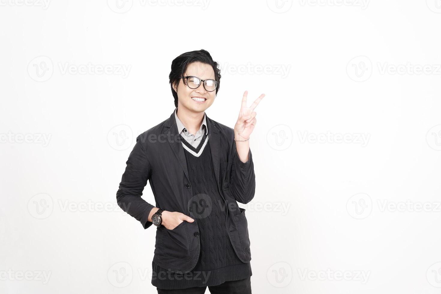 A man in glasses and a jacket is making a peace sign photo