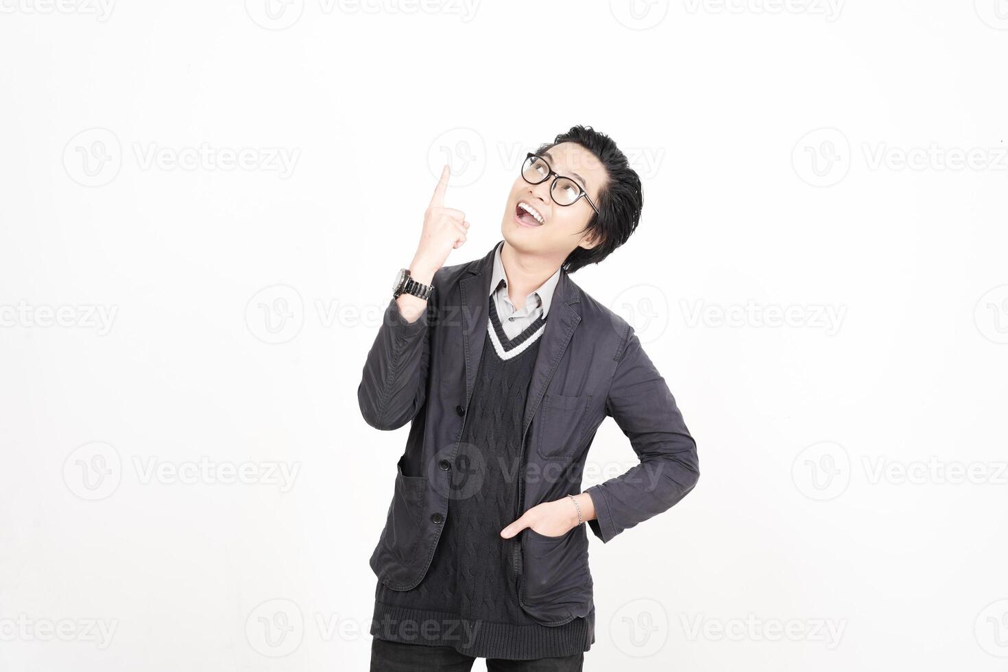 A man in glasses and a jacket is pointing up photo