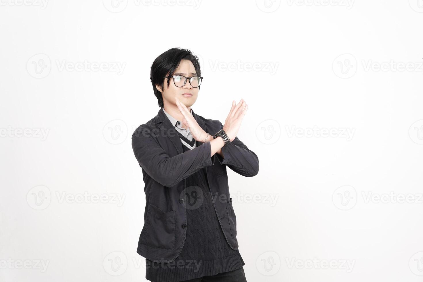 A man in glasses and a black jacket is making a gesture photo