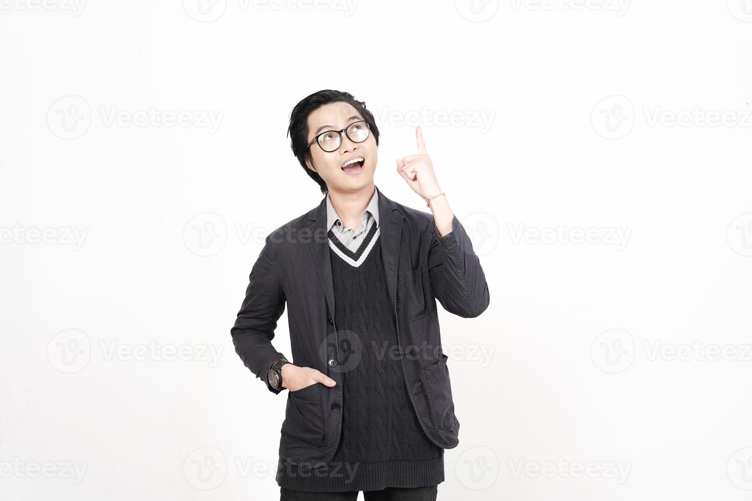 A man in glasses and a sweater pointing up photo
