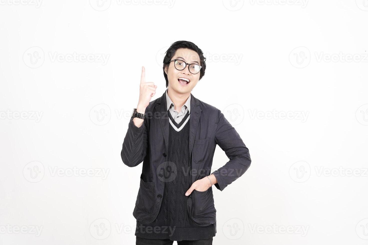 A man in glasses and a sweater is pointing his finger photo