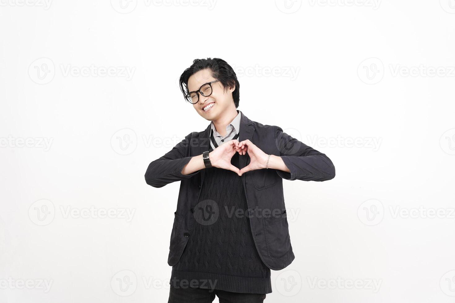 A man in glasses making a heart shape with his hands photo