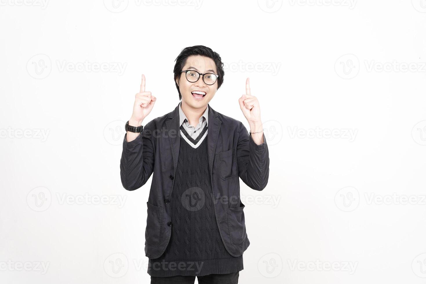 A man in glasses and a sweater is pointing up photo