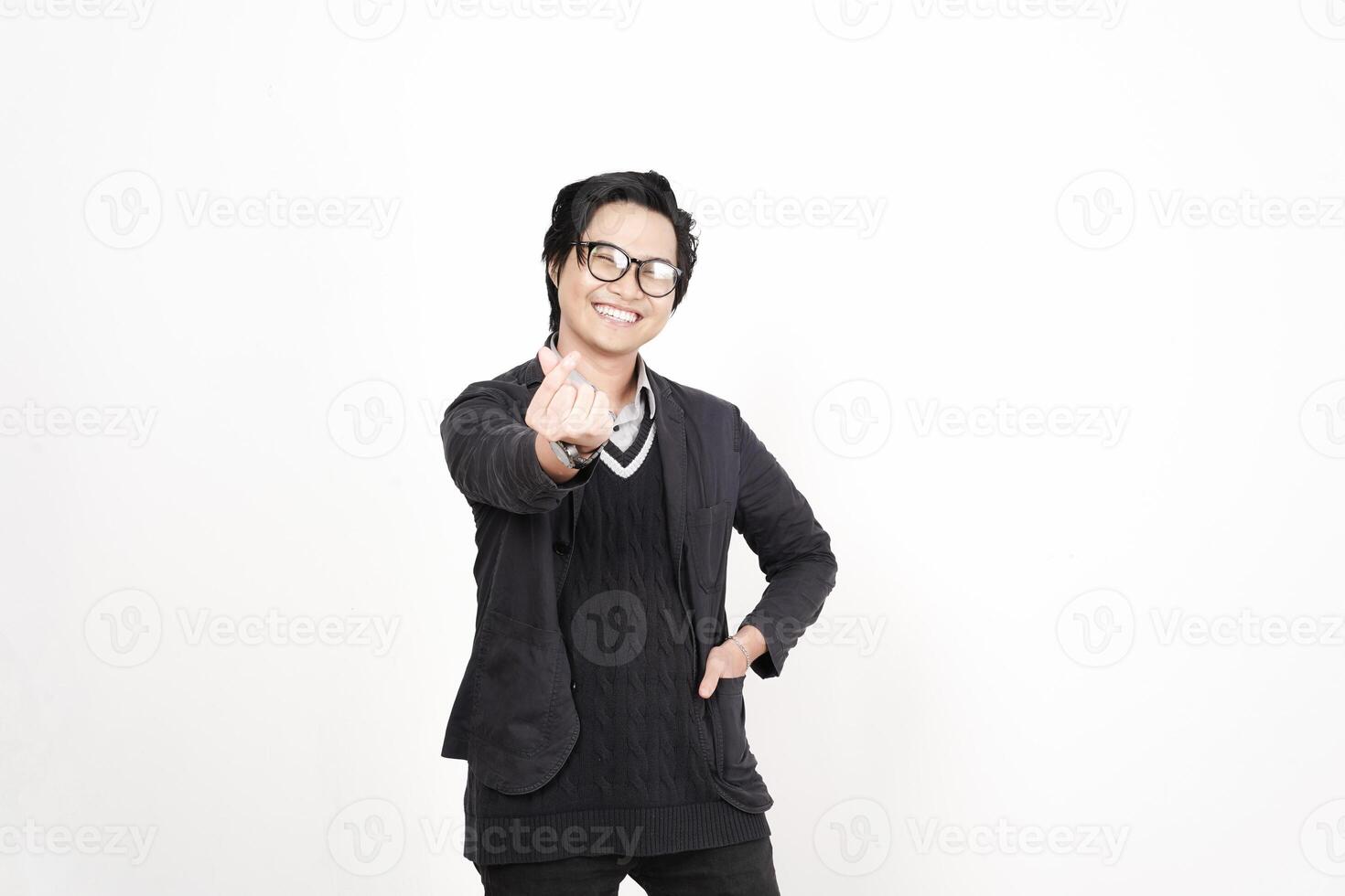 A man in glasses and a sweater is pointing at something photo