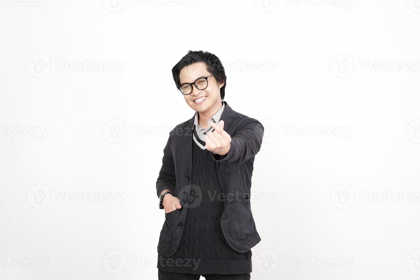 A man in glasses and a jacket is giving the thumbs up photo