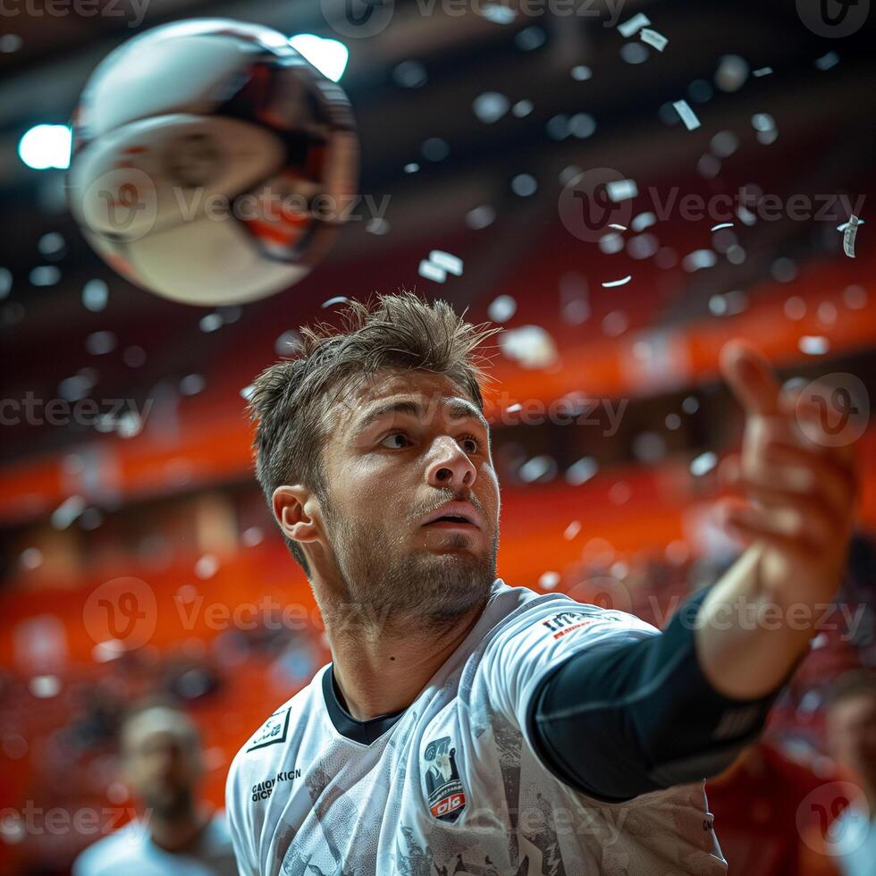 Intense moment of a player preparing to strike a volleyball during a vibrant indoor match. photo