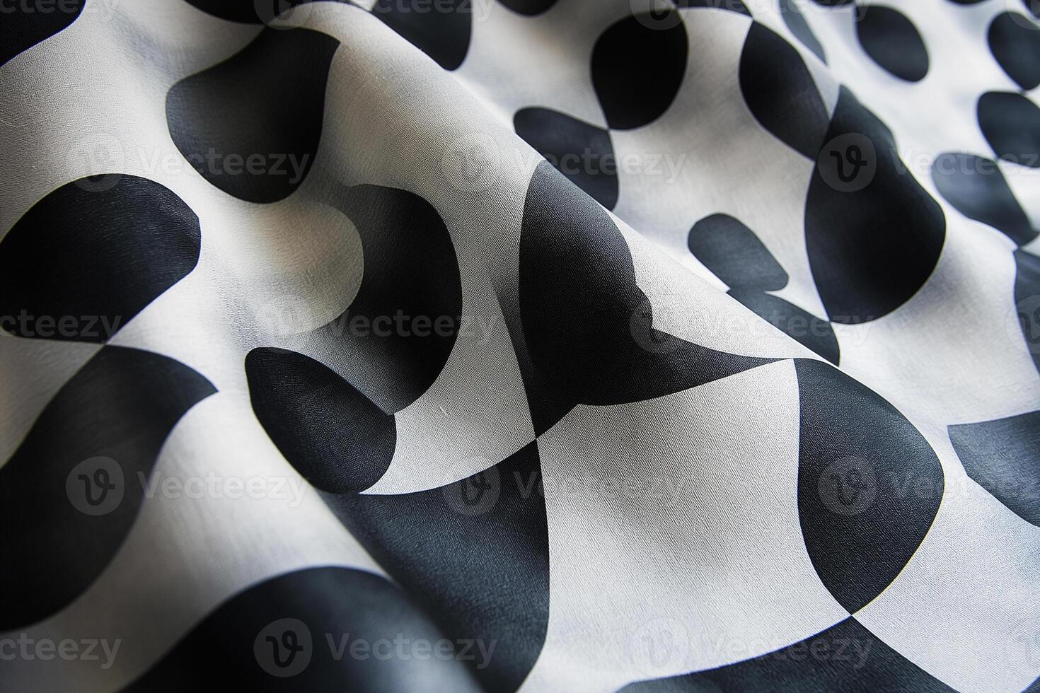 Elegant black and white fabric with abstract shapes flowing elegantly across the surface. photo