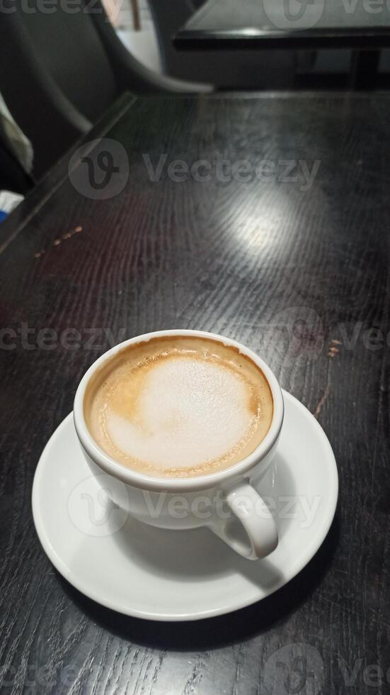 A freshly brewed cup of cappuccino photo