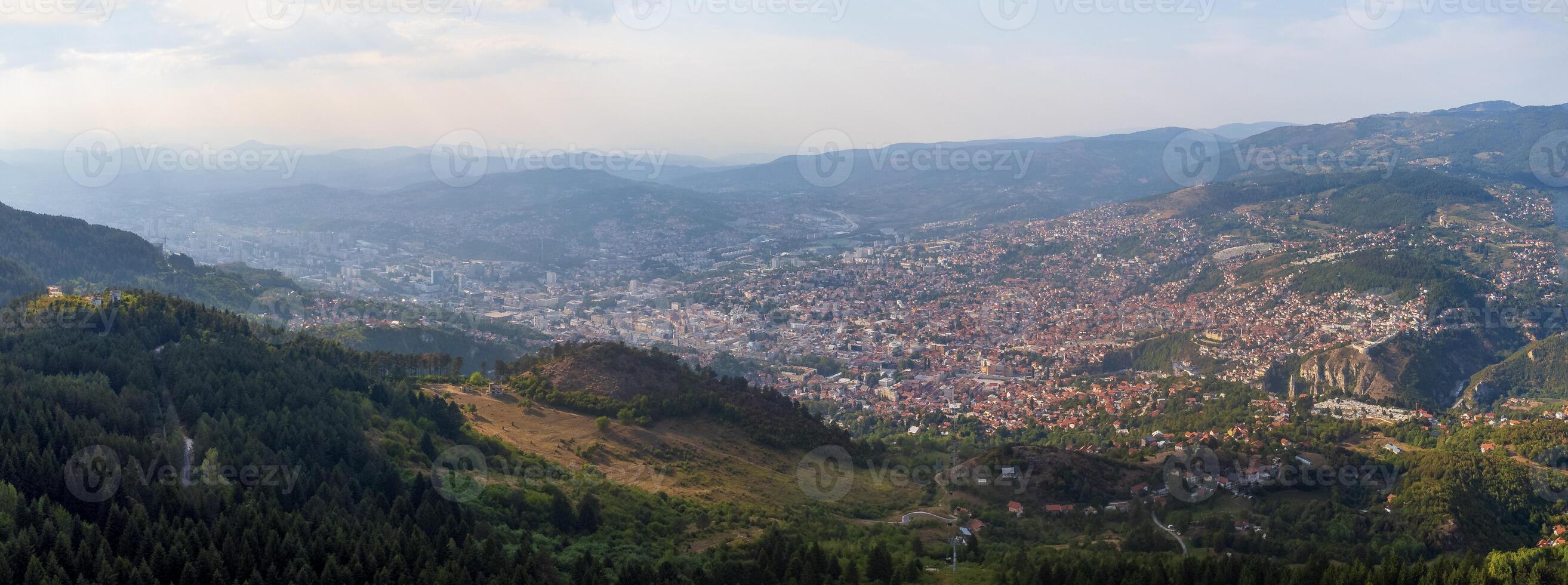 Aerial panoramic view of the city of Sarajevo, a tourist destination in Eastern Europe. View from a distance of the capital of Bosnia and Herzegovina photo