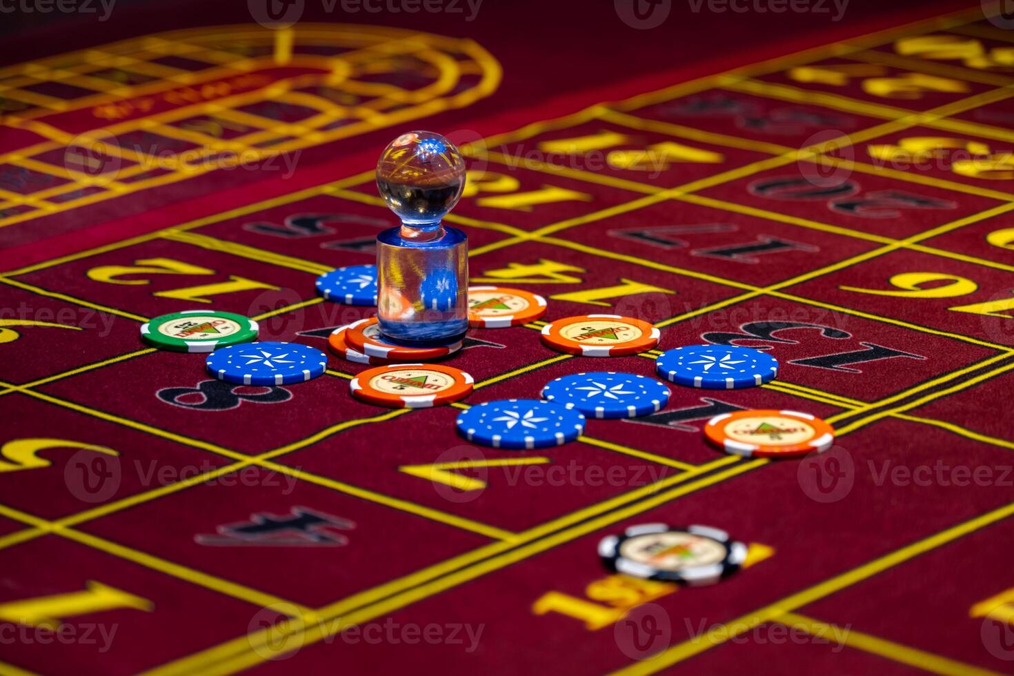 A casino table with chips and roulettes photo