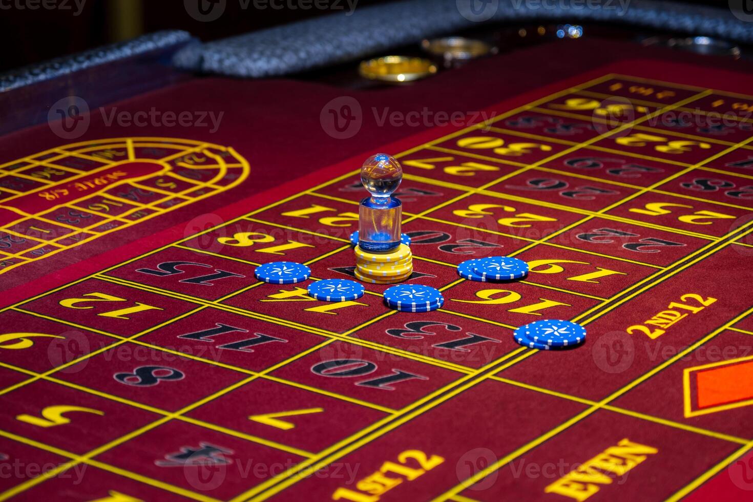 A roule table with chips and a roule photo