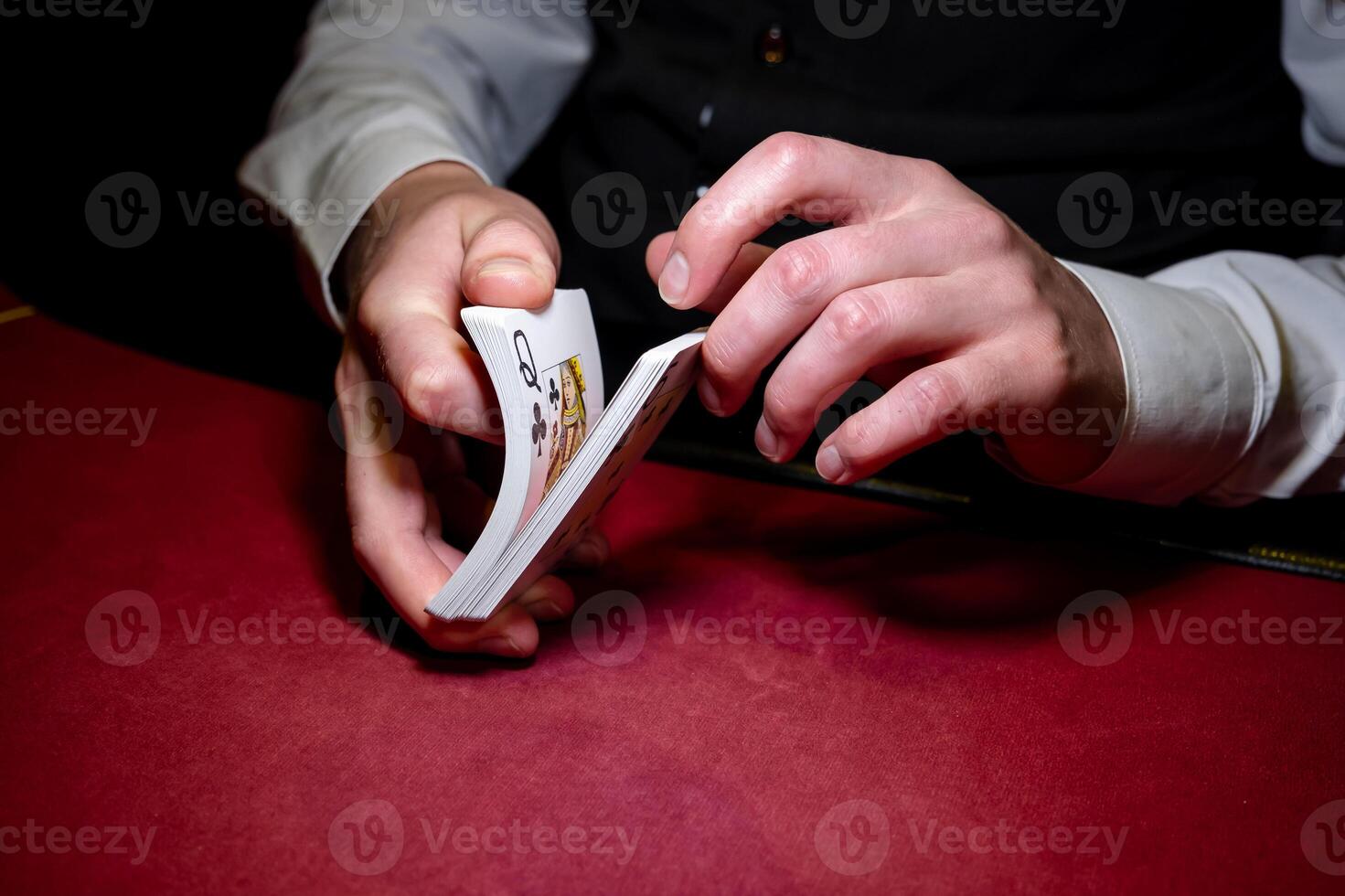 A man is holding a card in his hand photo