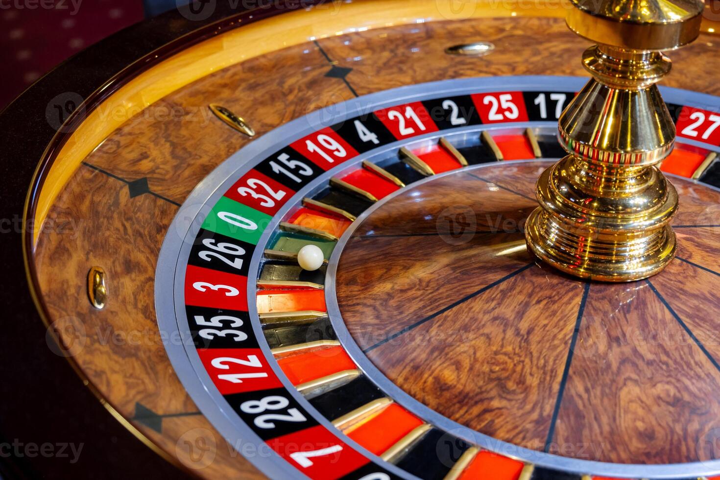 Roulette wheel. Casino. Gambling game. Roulette wheel on table in a casino. Roulette. The game in the casino. The concept of expectation of good luck. photo