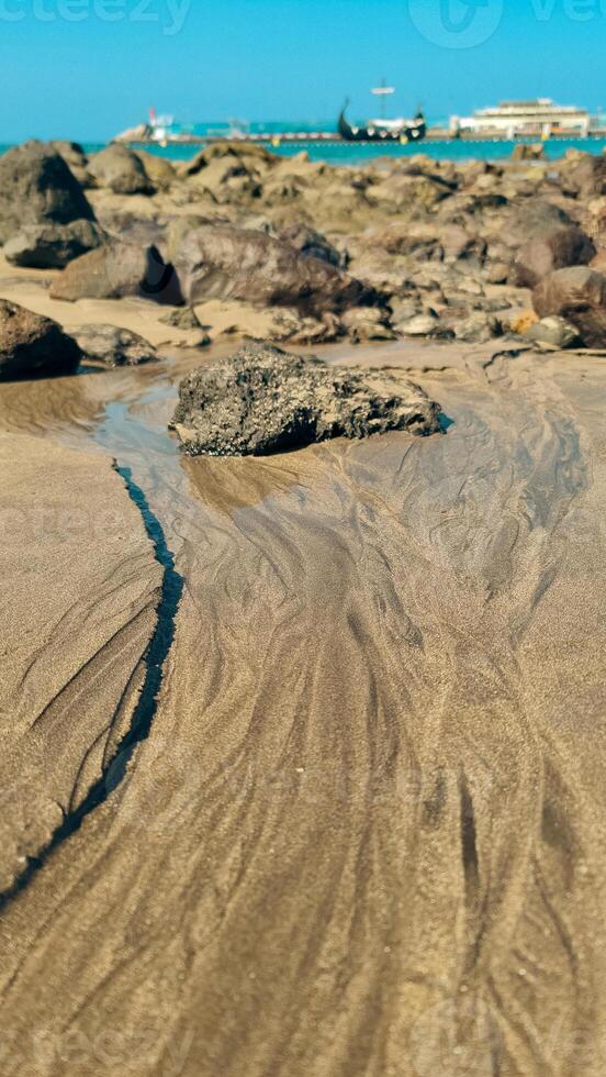 White and black sand together photo