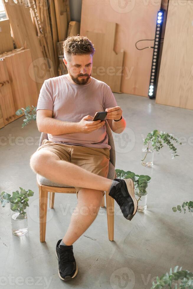 Portrait of frustrated confused frown guy, Sad upset handsome man read negative news on smartphone photo