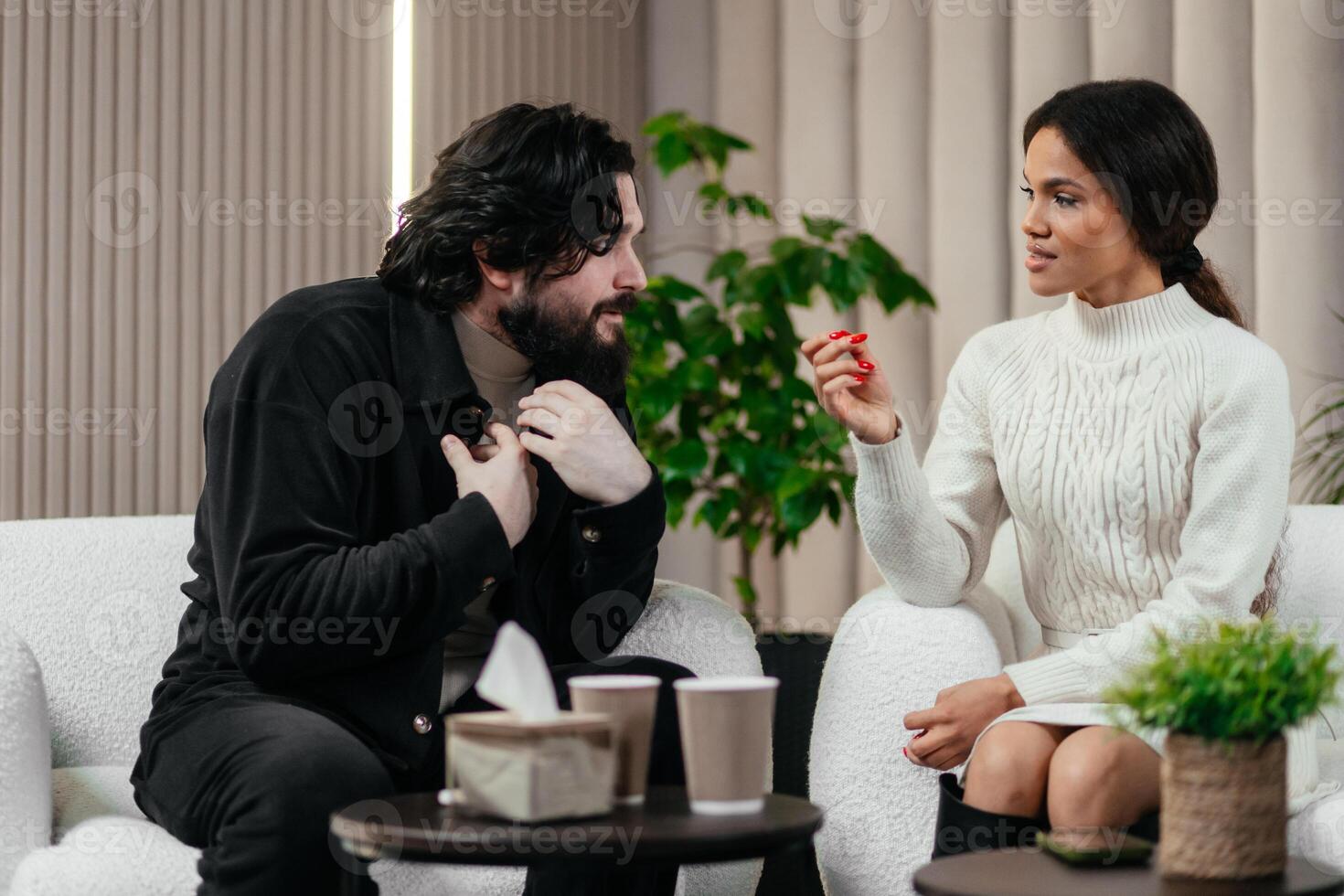 Psychology, stress and couple sit on sofa talking with therapist for counseling in anxiety, trauma or memory. Mental health, psychologist and person with depression on couch for consultation photo