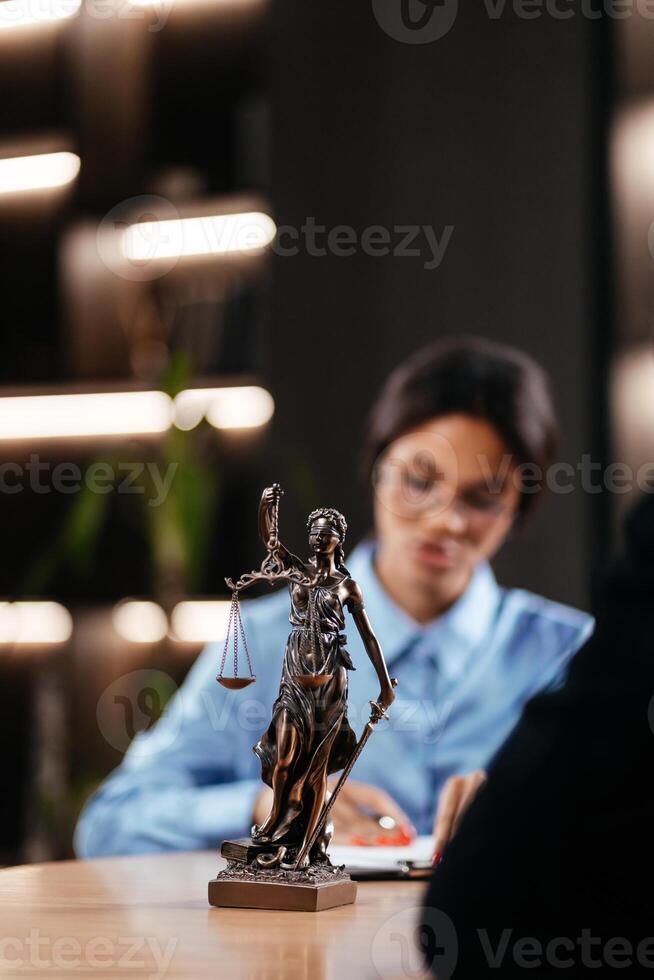 Black woman lawyer consulting a business client in a modern office. Concept of professional legal services for businesses, focusing on tax planning. Justice and law, court judge. Vertical photo