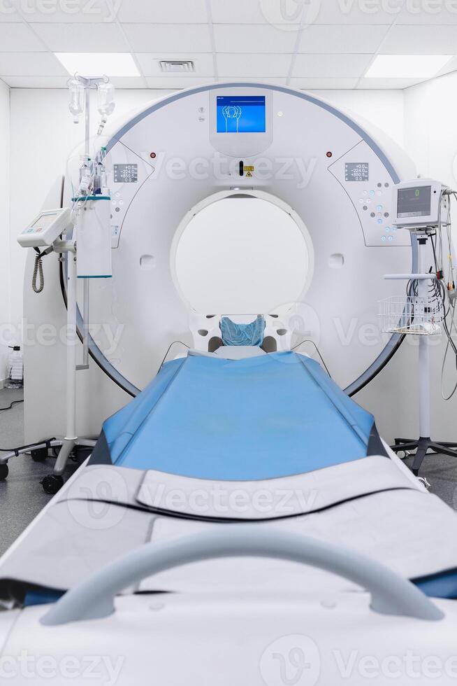 A high-angle shot of a CT scan machine room, showing the advanced medical imaging equipment and the clean, organized environment of the room photo